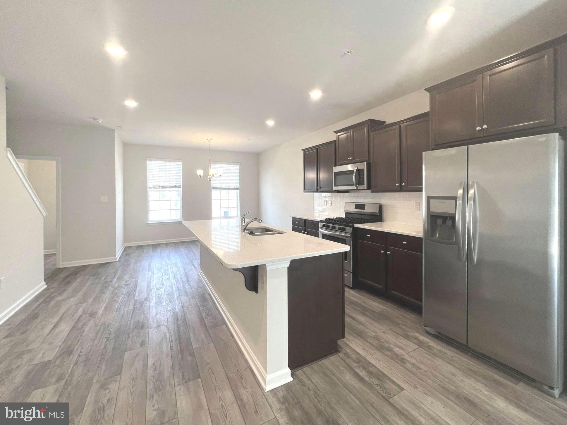 2013 Thornbrook Way Odenton, MD 21113 - Photo 2 of 17 a kitchen with kitchen island wooden floors appliances and cabinets
