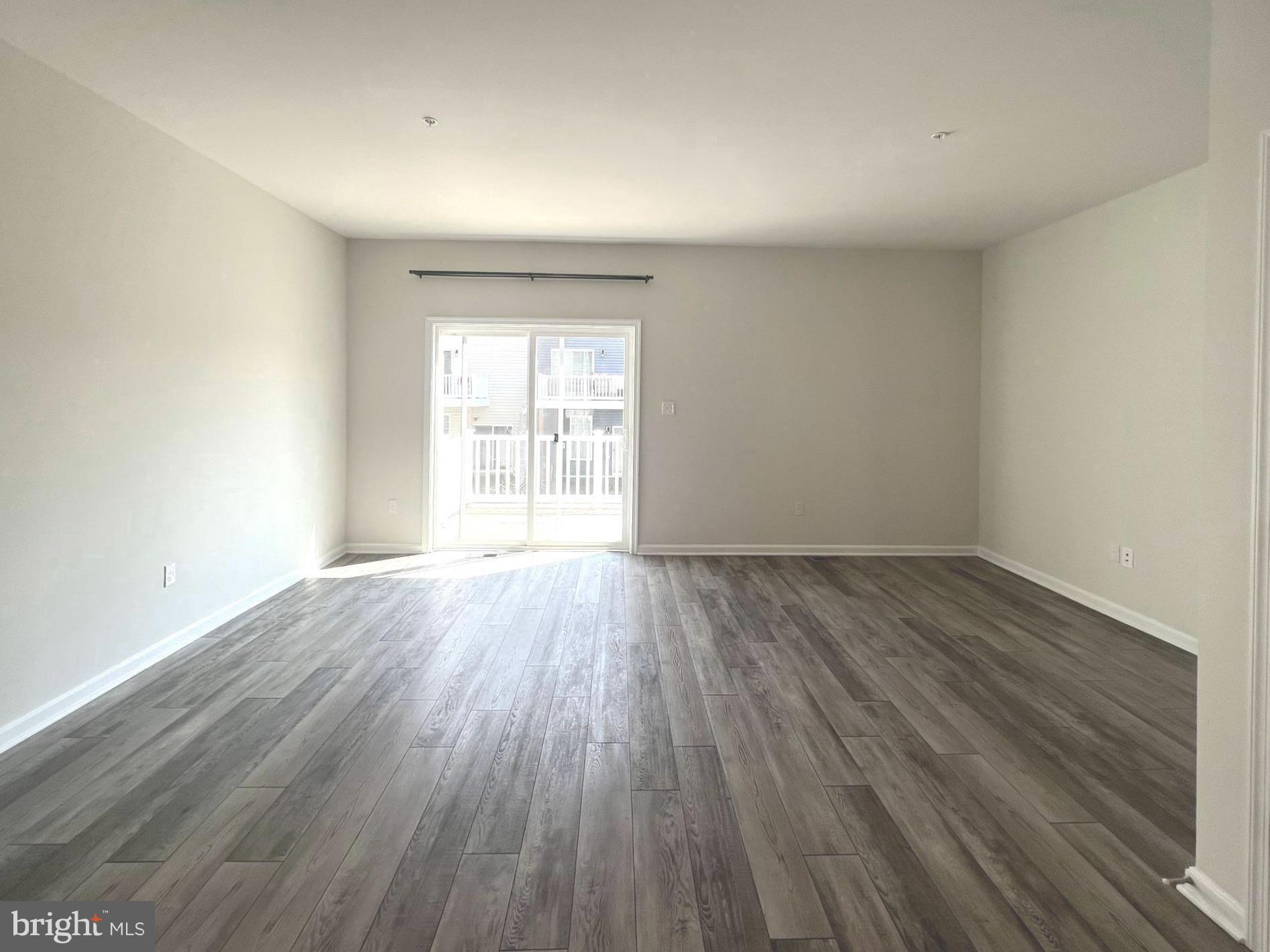 2013 Thornbrook Way Odenton, MD 21113 - Photo 3 of 17 an empty room with wooden floor and windows