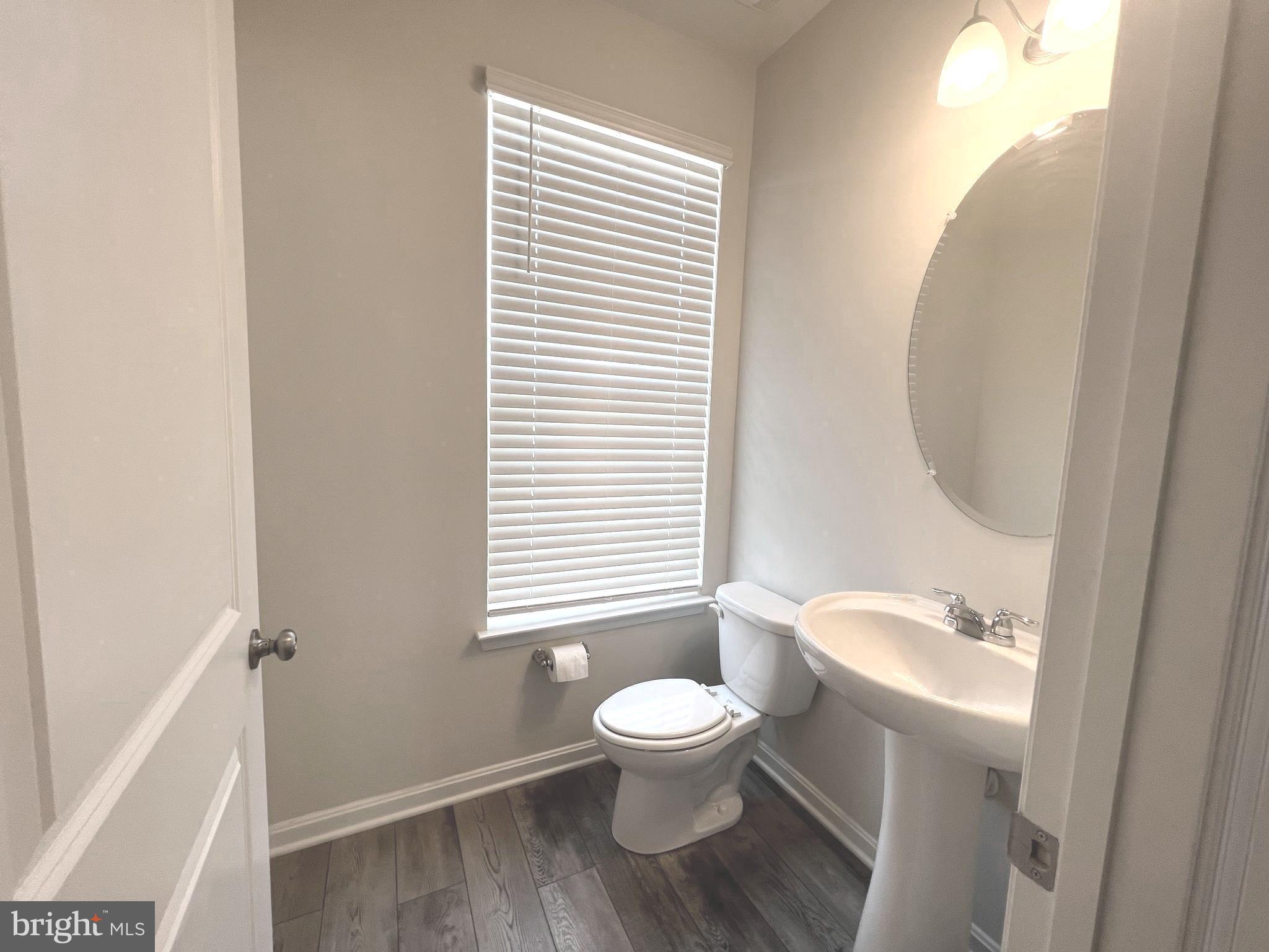 2013 Thornbrook Way Odenton, MD 21113 - Photo 5 of 17 a bathroom with a toilet a sink and a window