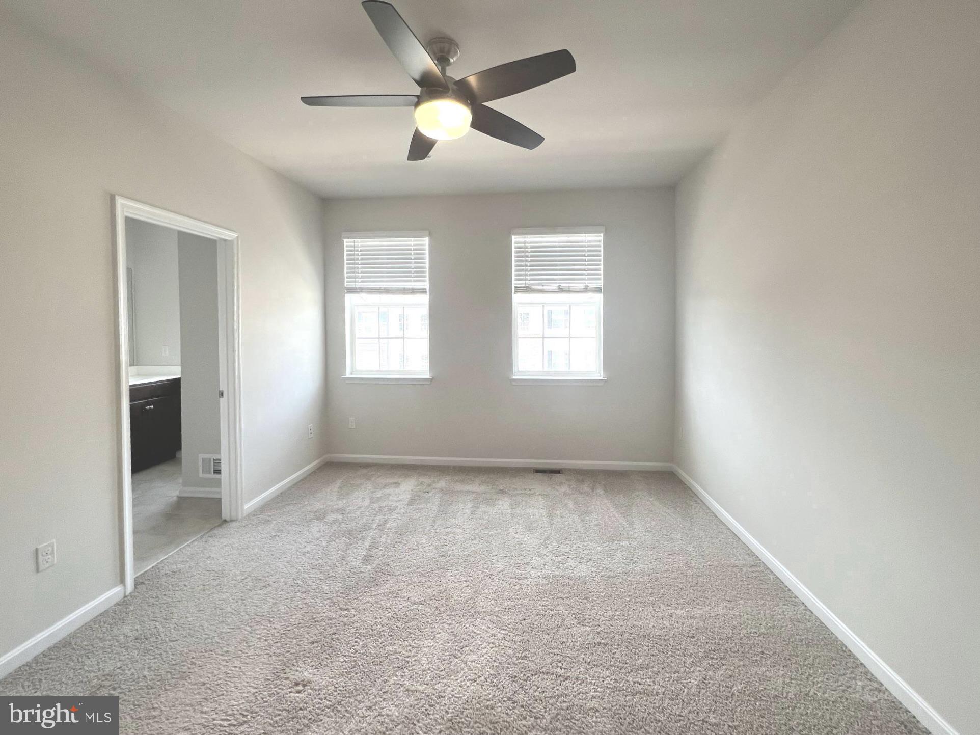 2013 Thornbrook Way Odenton, MD 21113 - Photo 6 of 17 an empty room with windows and fan
