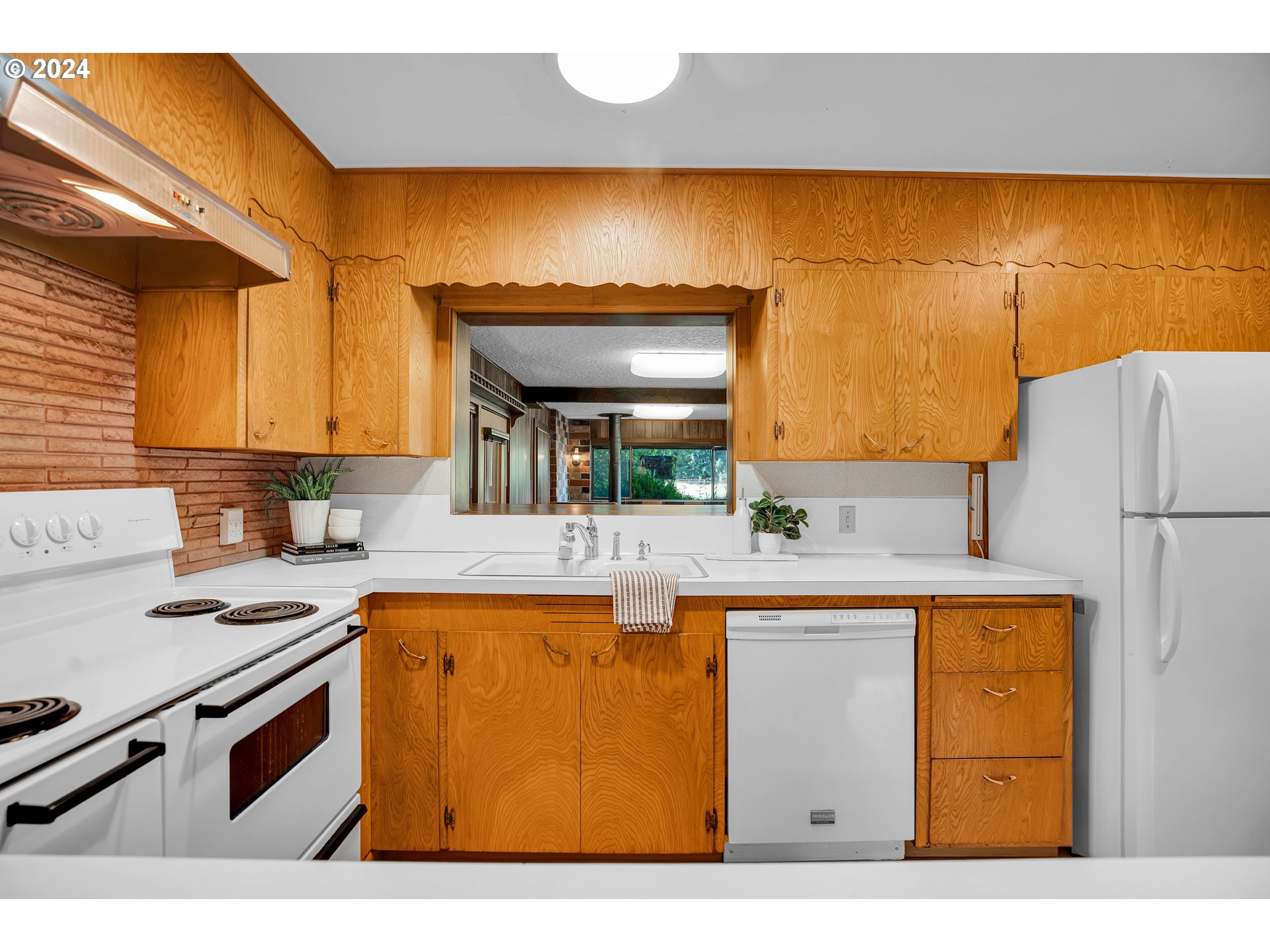 708 Southeast Northway Road Corbett, OR 97019 - Photo 22 of 47 a kitchen with stainless steel appliances granite countertop a sink and a refrigerator