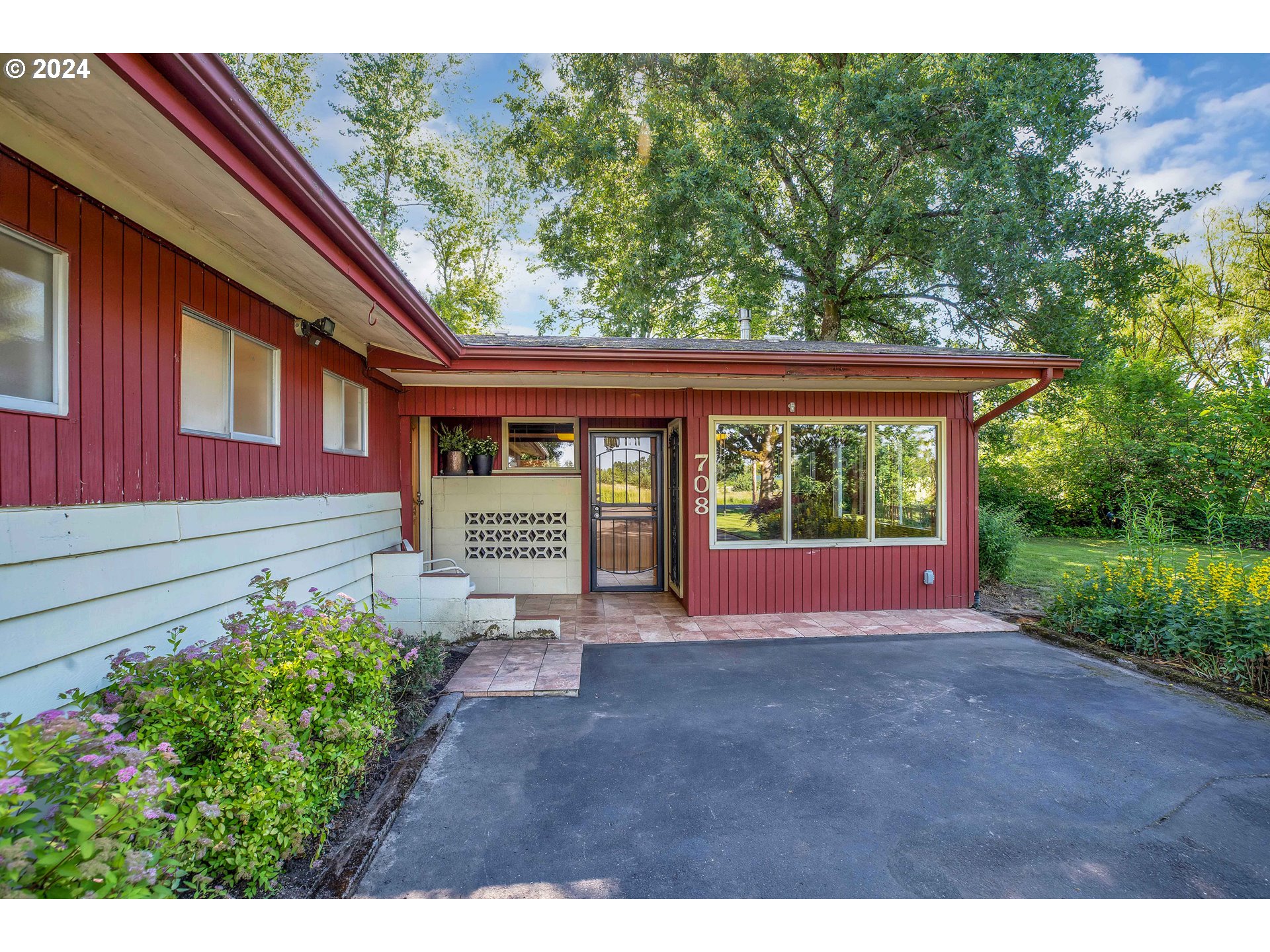 708 Southeast Northway Road Corbett, OR 97019 - Photo 3 of 47 a house view with a garden space