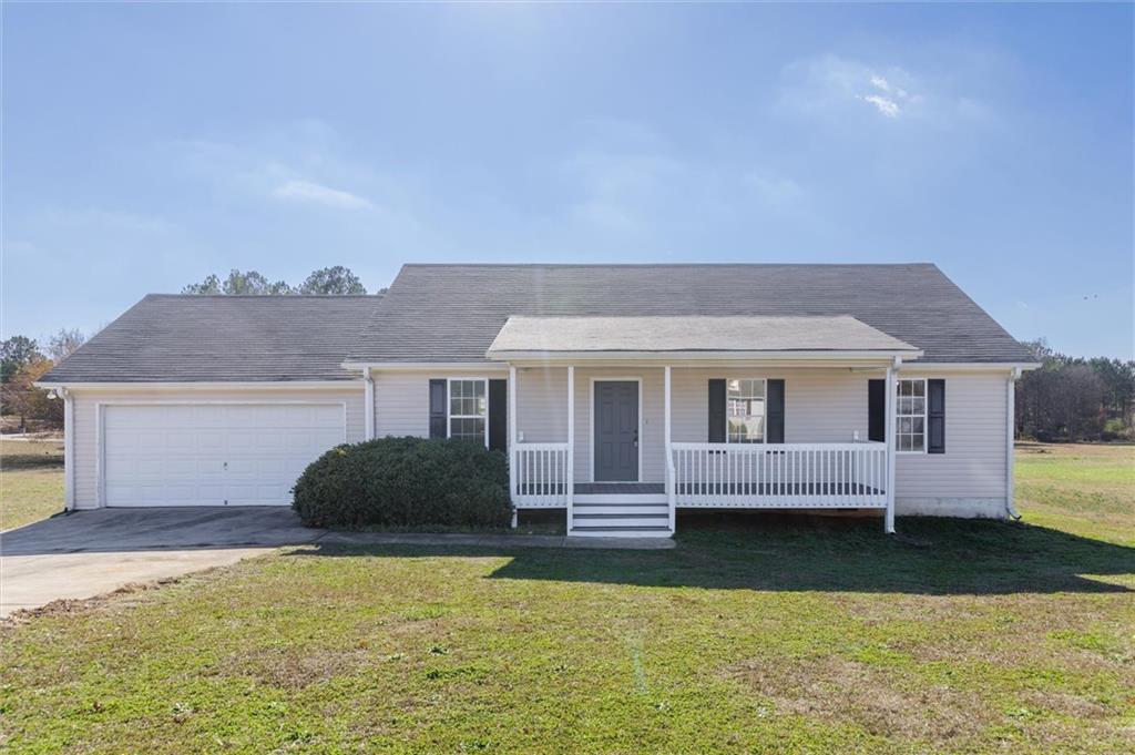 11 Russell Ridge Southwest Euharlee, GA 30145 - Photo 1 of 1 Ranch-style house with a front yard, a garage, and covered porch