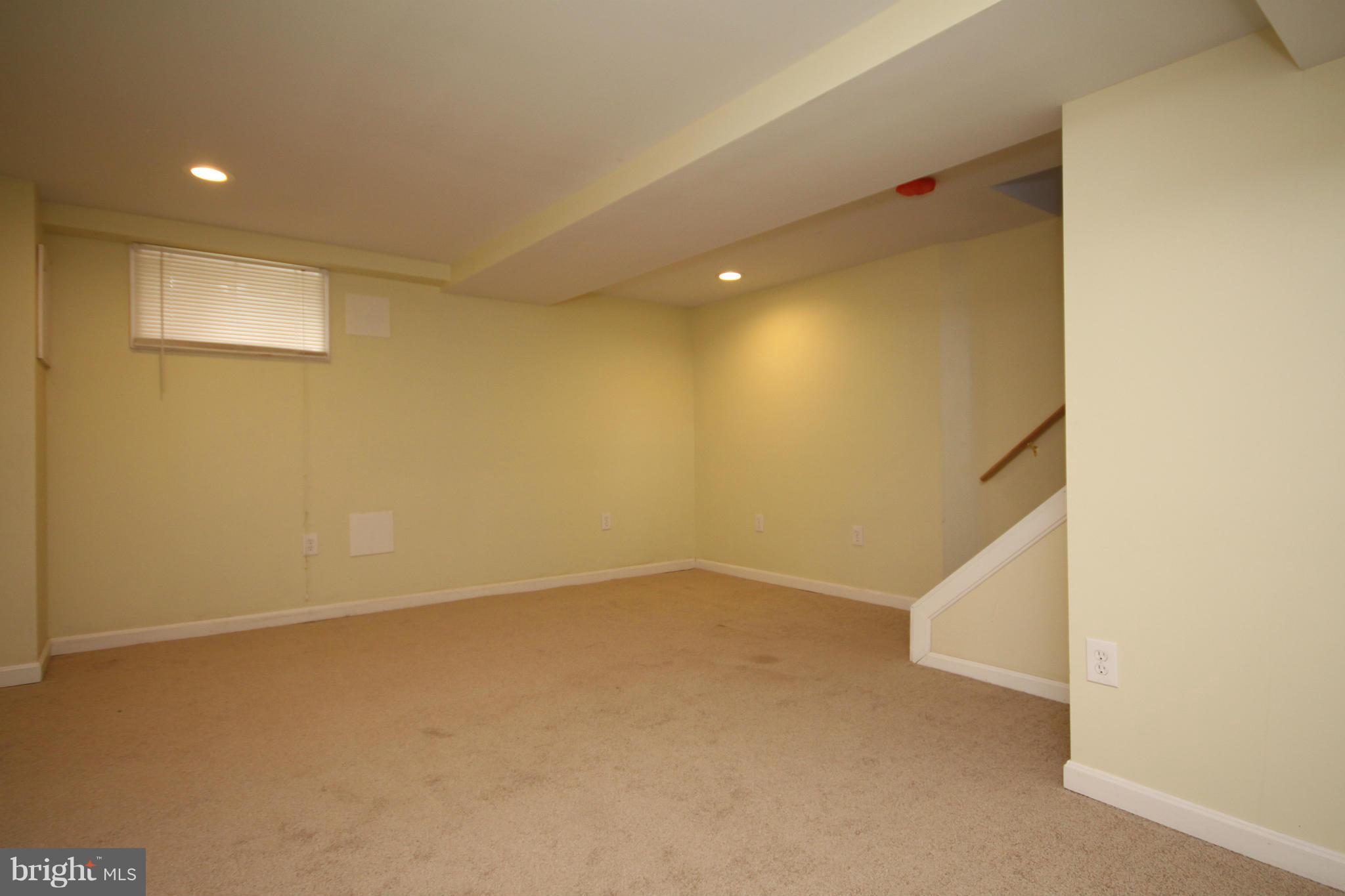 416 Old Riverside Road Baltimore, MD 21225 - Photo 22 of 28 an empty room with a ceiling fan and entryway