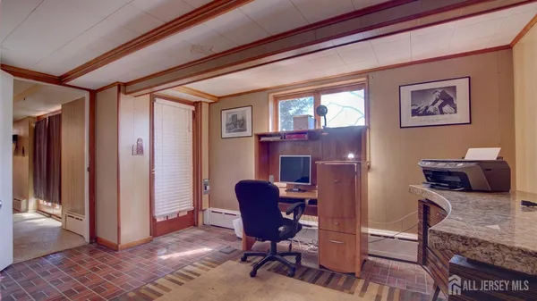 a workspace with furniture and a potted plant