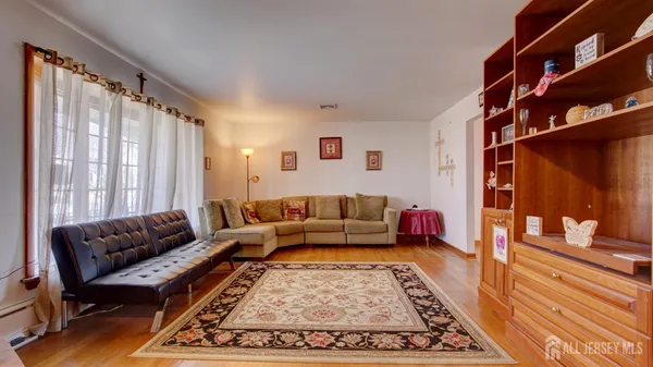 a living room with furniture and a rug