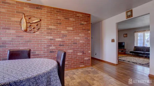 a view of a livingroom with furniture and wooden floor
