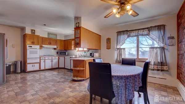 a view of a dining room with furniture window and outside view