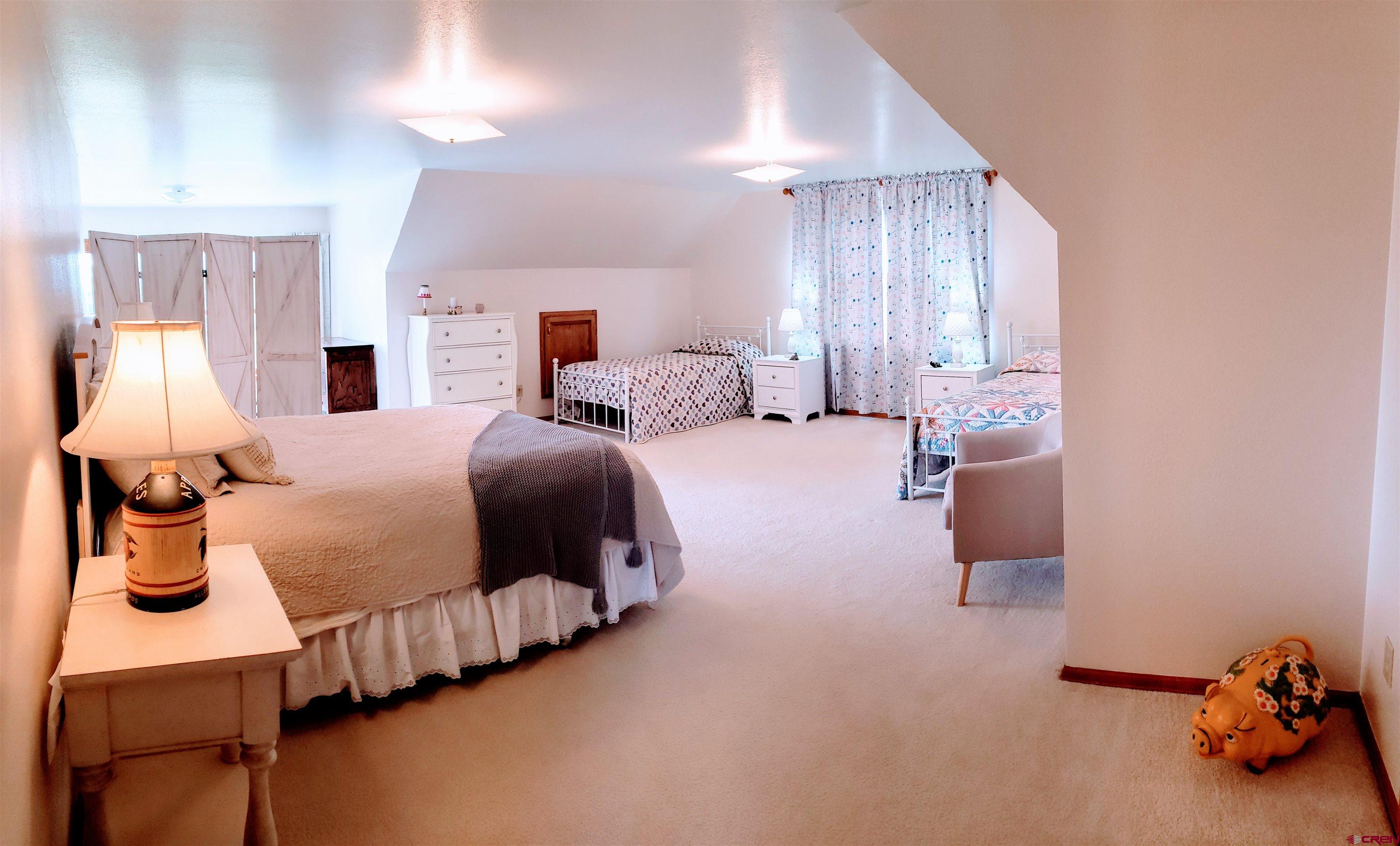 21669 Myers Road Orchard City, CO 81418 - Photo 19 of 35 a bedroom with bed and window