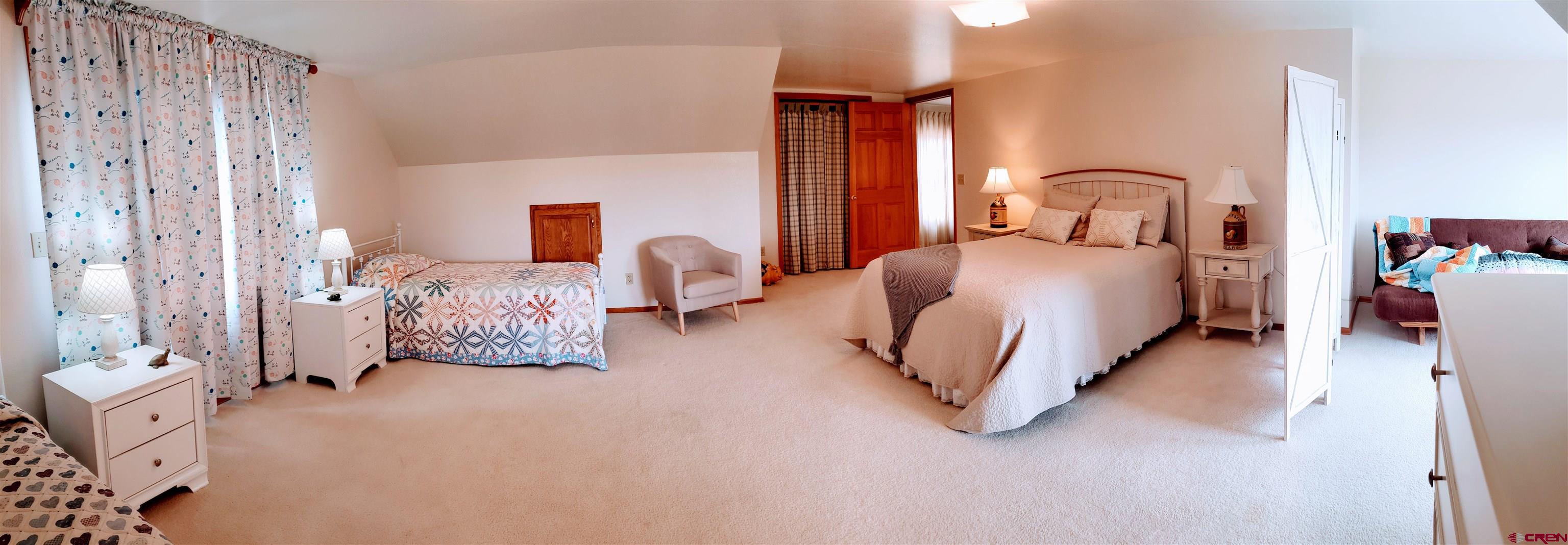 21669 Myers Road Orchard City, CO 81418 - Photo 21 of 35 a bedroom with bed and window