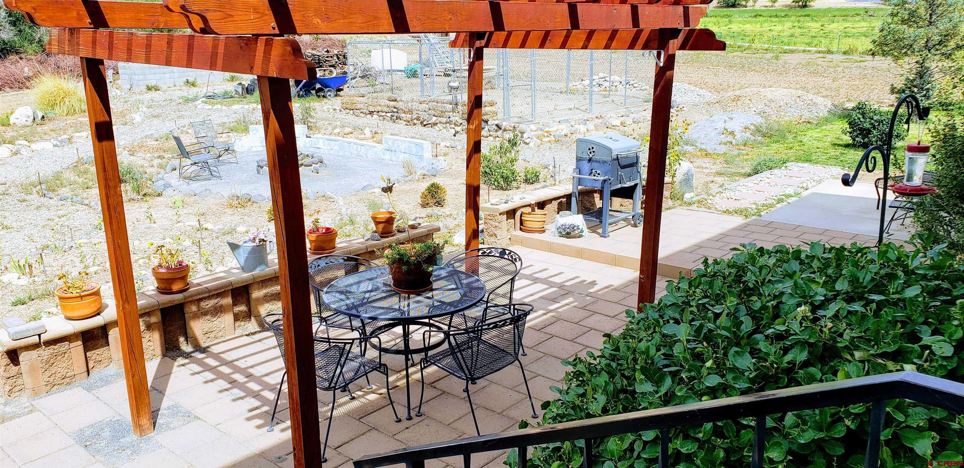 21669 Myers Road Orchard City, CO 81418 - Photo 33 of 35 a view of a balcony with chairs and wooden fence