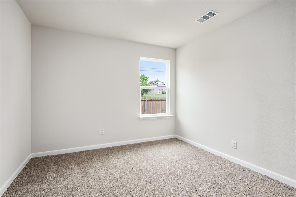 6326 Emerald Tree Lane Dallas, TX 75241 - Photo 17 of 20 an empty room with windows