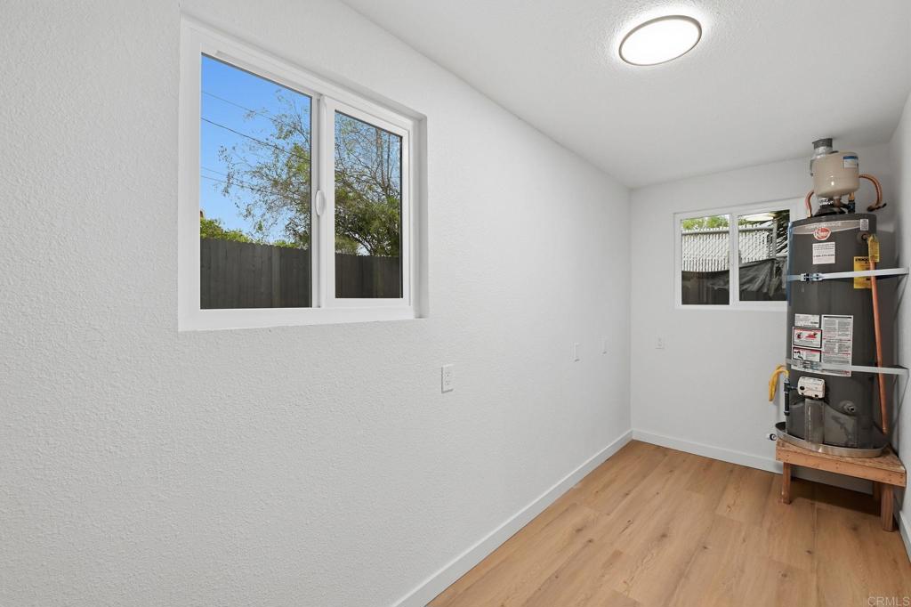 1333 Helix Street Spring Valley, CA 91977 - Photo 41 of 45 a view of a room with wooden floor and furniture