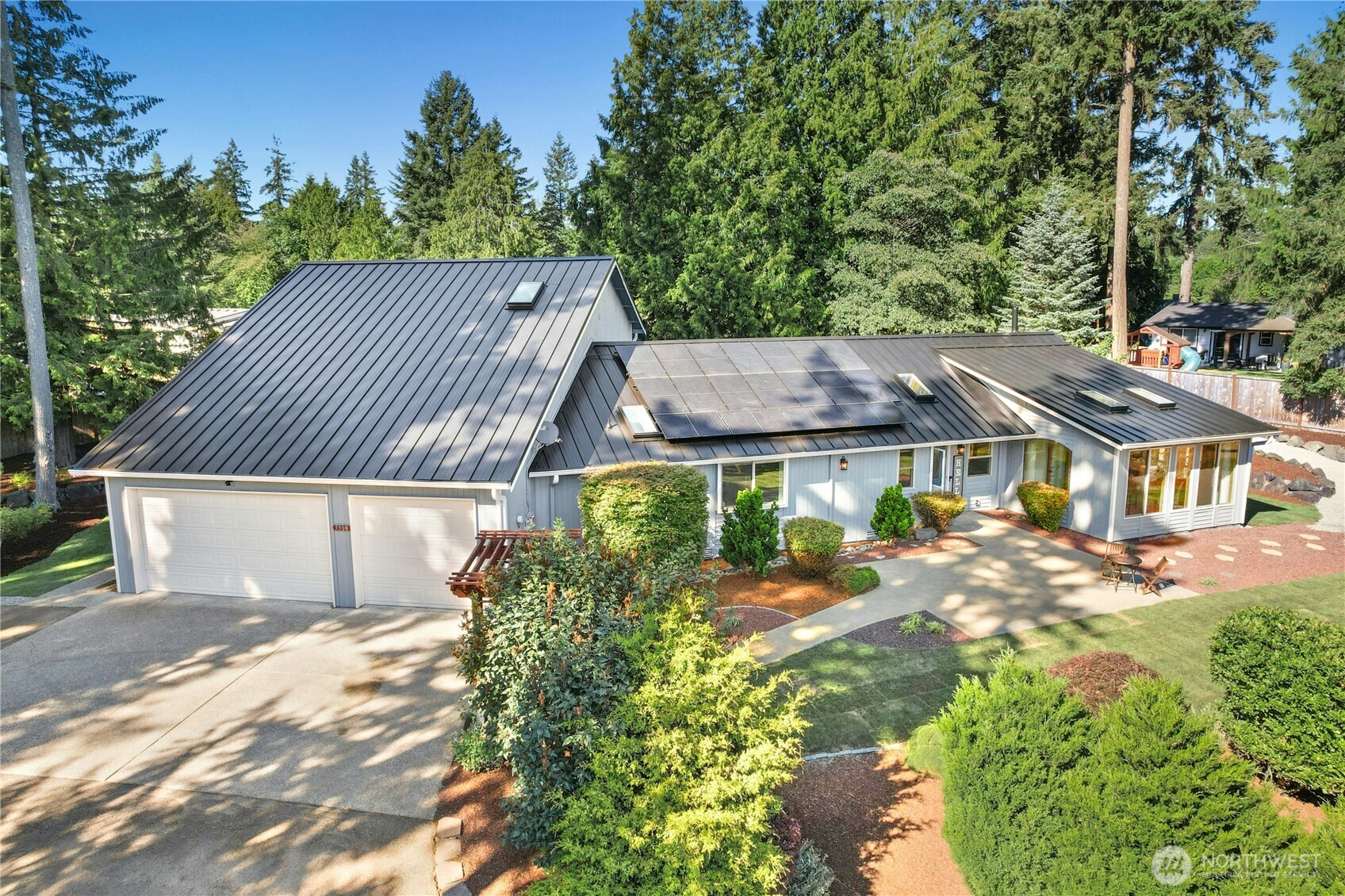 5508 Northeast 10th Street Renton, WA 98059 - Photo 1 of 40 a view of a big house with a big yard plants and large trees