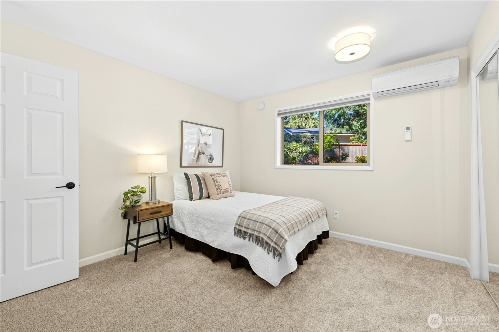 5508 Northeast 10th Street Renton, WA 98059 - Photo 17 of 40 a bedroom with a bed and a window