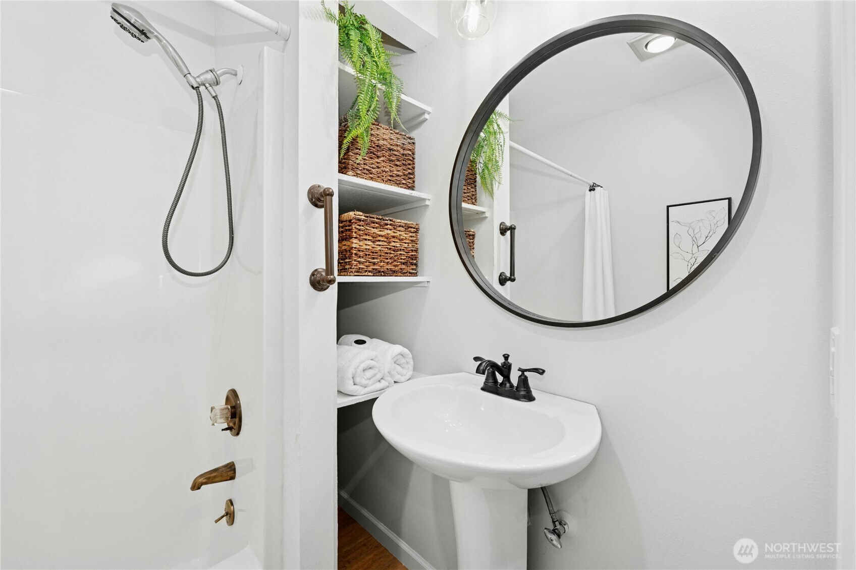 5508 Northeast 10th Street Renton, WA 98059 - Photo 18 of 40 a bathroom with a sink a mirror and a toilet