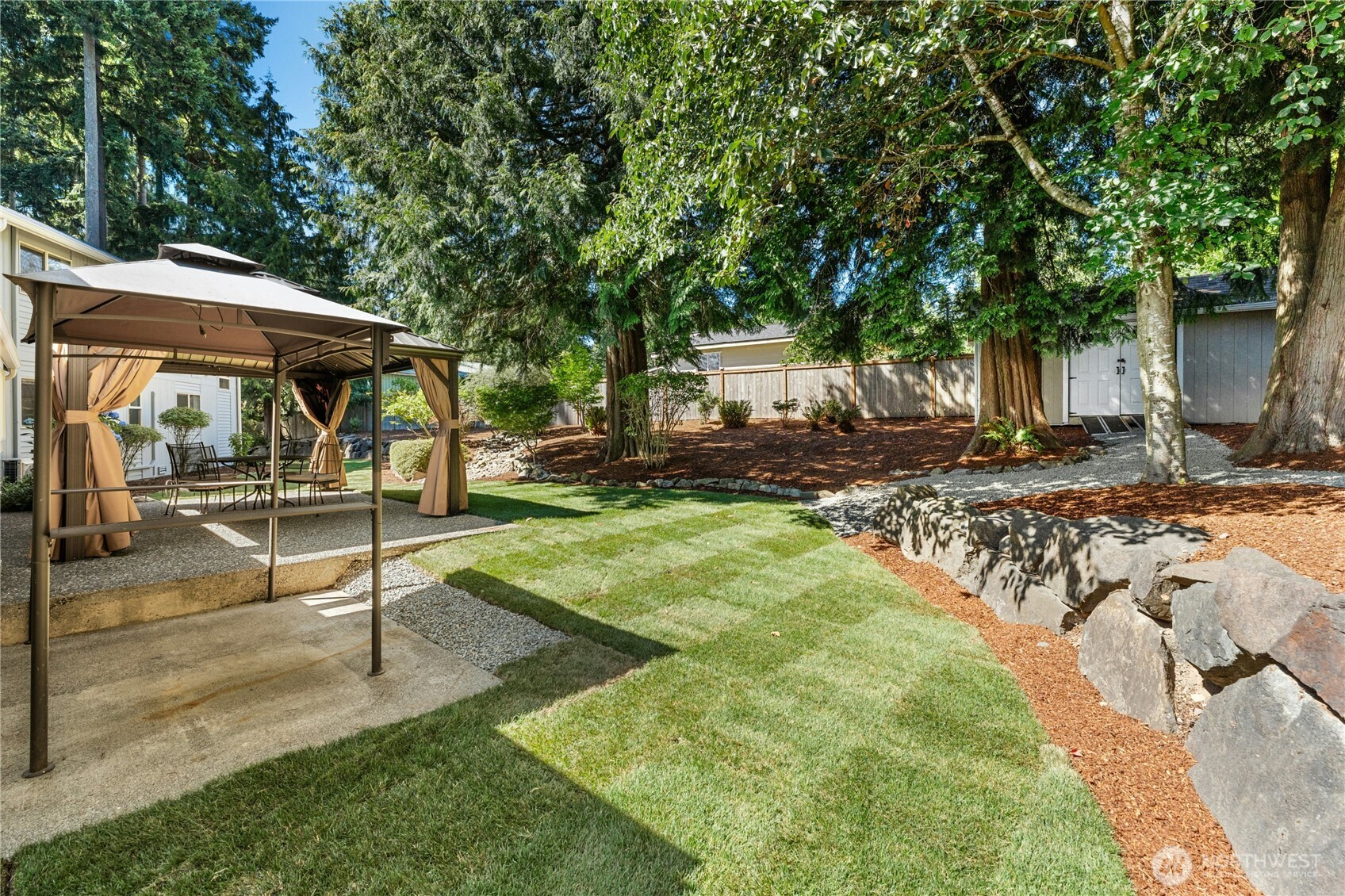 5508 Northeast 10th Street Renton, WA 98059 - Photo 28 of 40 a view of a backyard with large tree