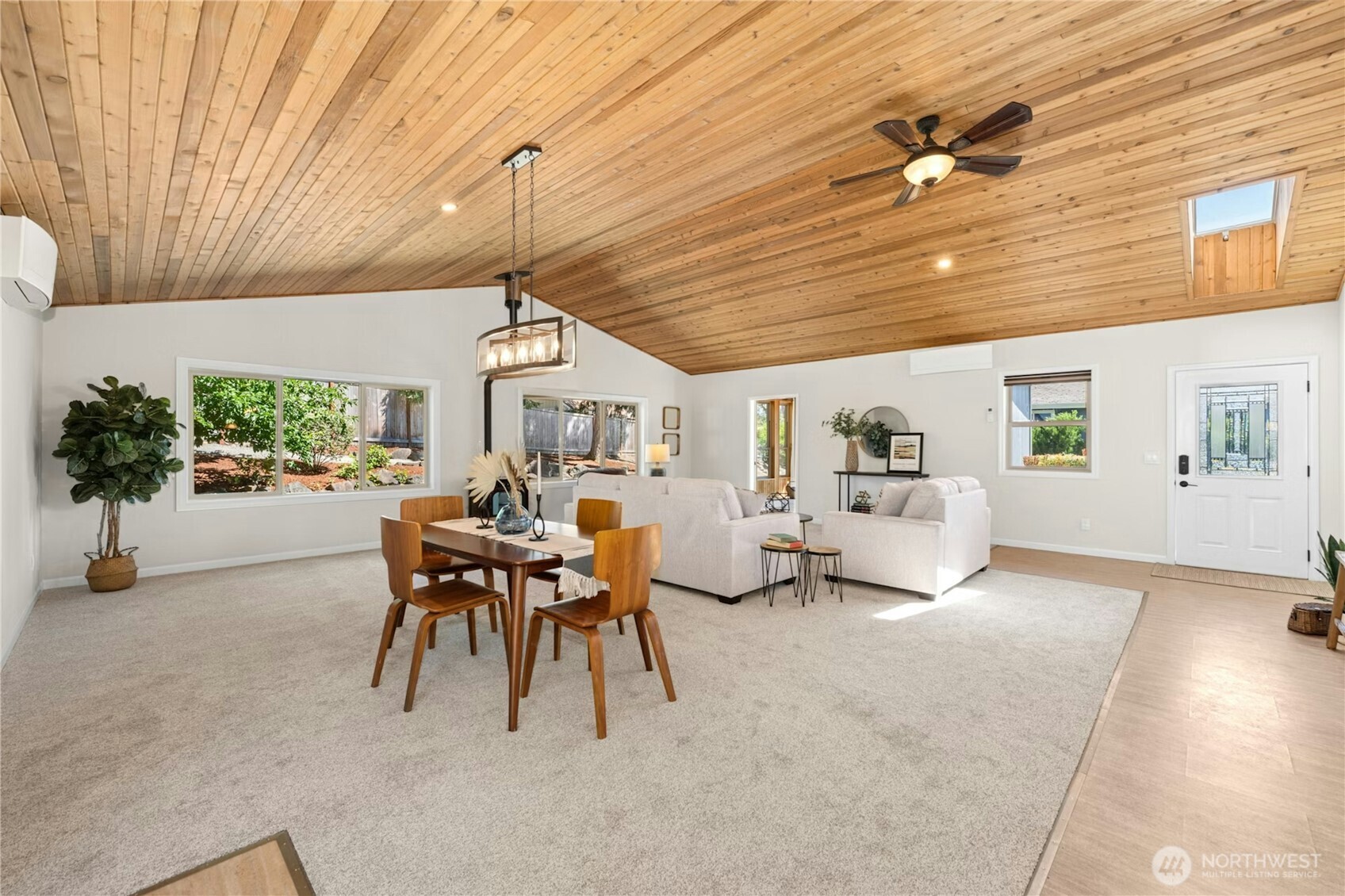 5508 Northeast 10th Street Renton, WA 98059 - Photo 5 of 40 a dining room with furniture and a chandelier