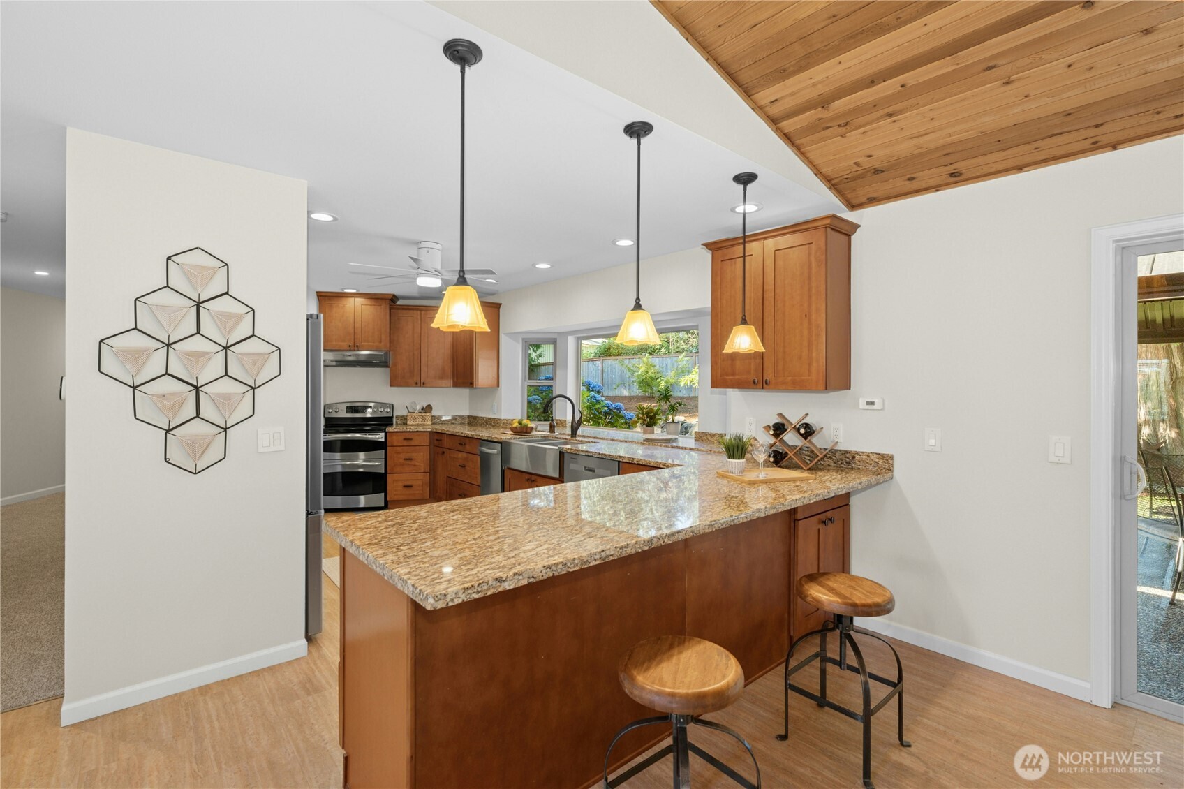 5508 Northeast 10th Street Renton, WA 98059 - Photo 8 of 40 a kitchen with a sink a counter space and chairs