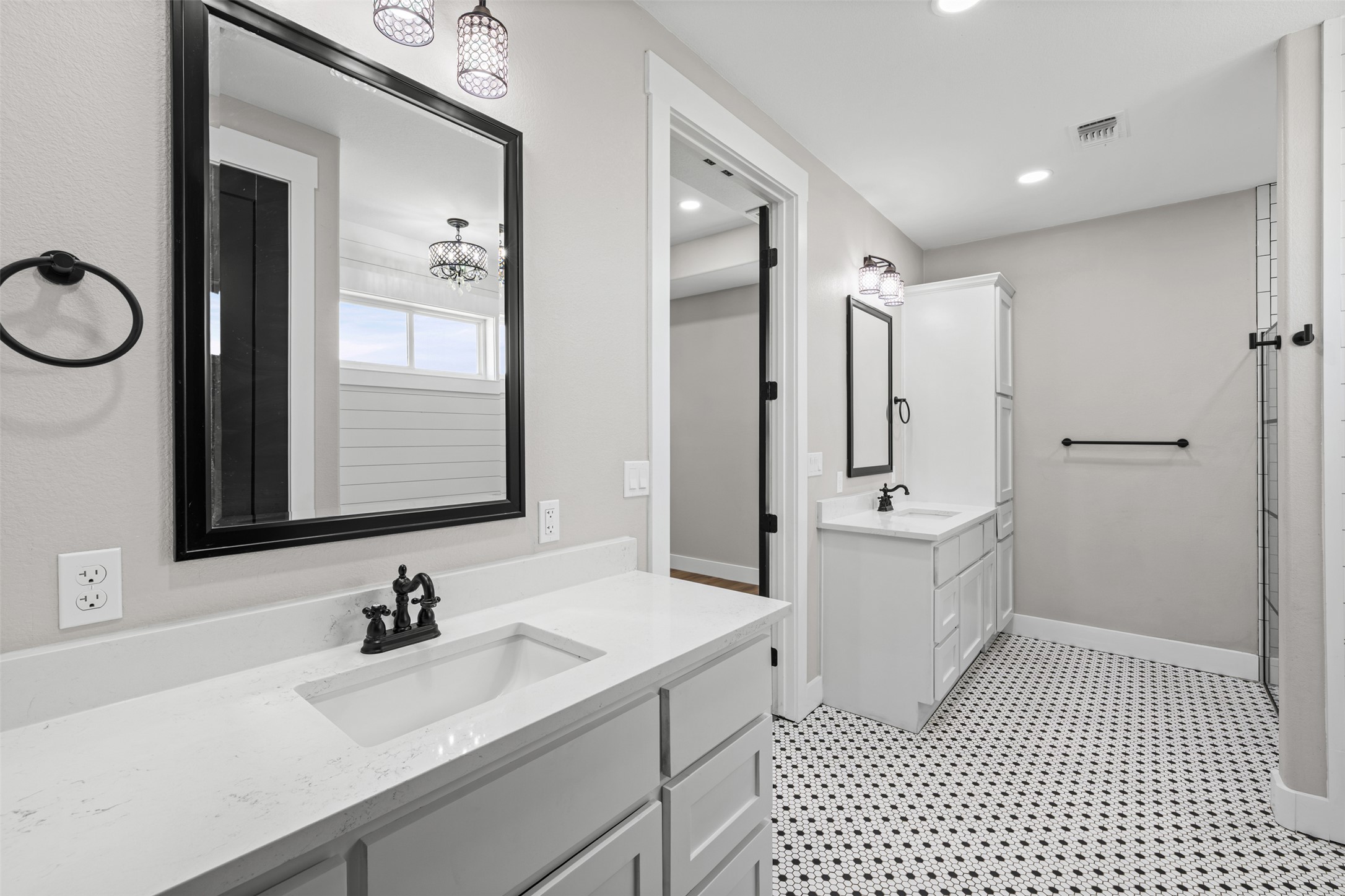 1060 Hackberry Road Salado, TX 76571 - Photo 12 of 19 Geometric patterned tile floors and sleek stone counters define this modern master bath layout.