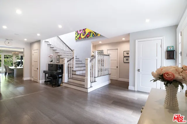 a view of a livingroom with furniture and an empty room