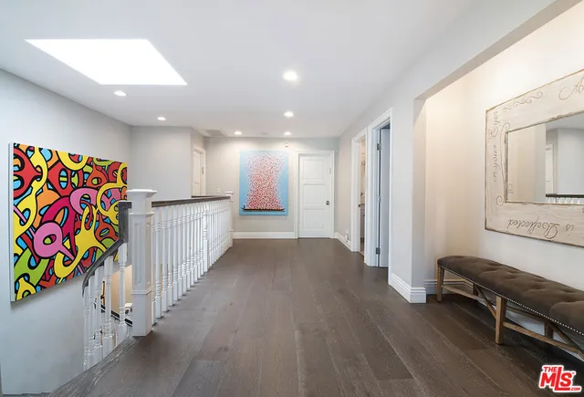 a view of a hallway with stairs