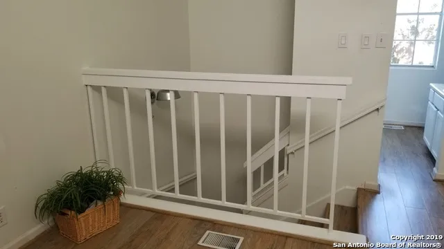 a bedroom with a bed and a potted plant