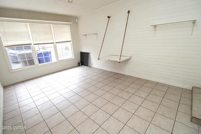 a view of an empty room and window