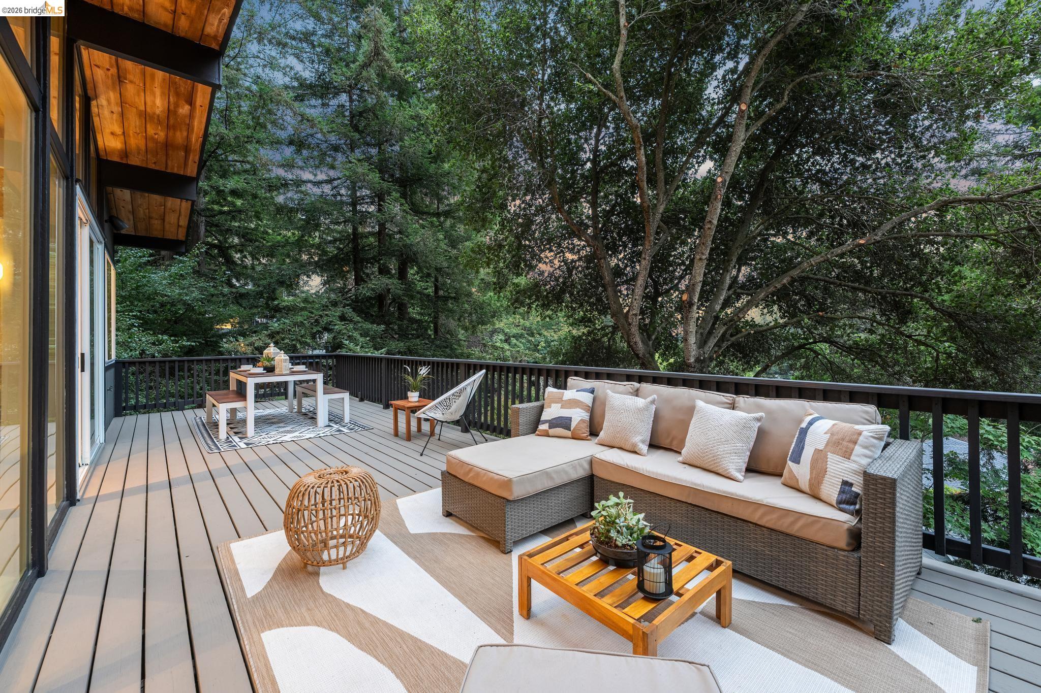 6645 Heather Ridge Way Oakland, CA 94611 - Photo 4 of 61 Expansive outdoor deck featuring wood-finish flooring and a black railing system