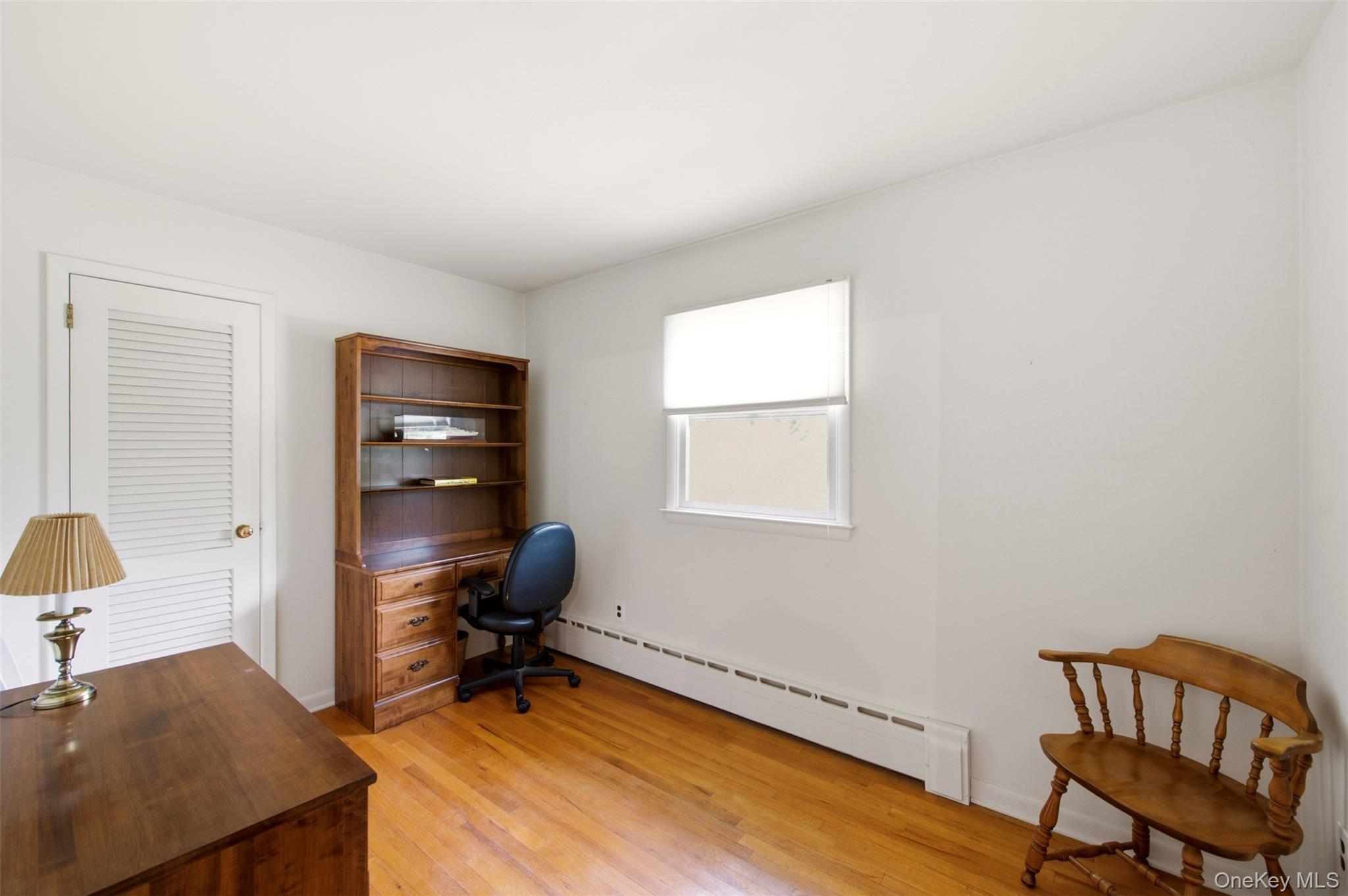 2 Ottawa Avenue Centerport, NY 11721 - Photo 11 of 15 a view of a workspace with furniture and a window