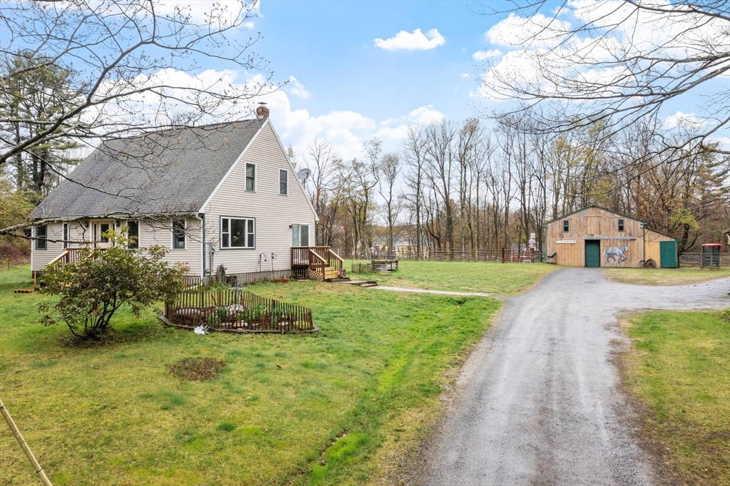 340 Ball Hill Road Princeton, MA 01541 - Photo 1 of 41 a front view of a house with garden