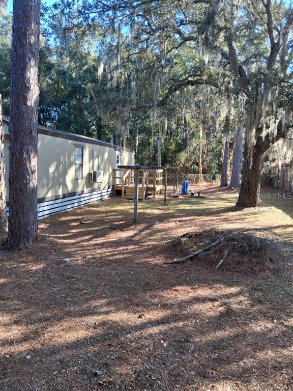 6332 West Homosassa Trail Homosassa, FL 34448 - Photo 12 of 13 a view of street with trees and houses