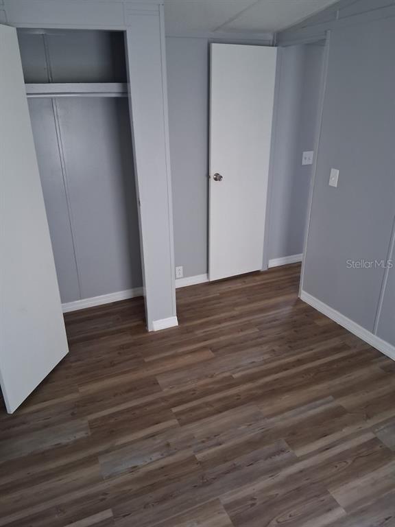 6332 West Homosassa Trail Homosassa, FL 34448 - Photo 8 of 13 a view of an empty room with wooden floor