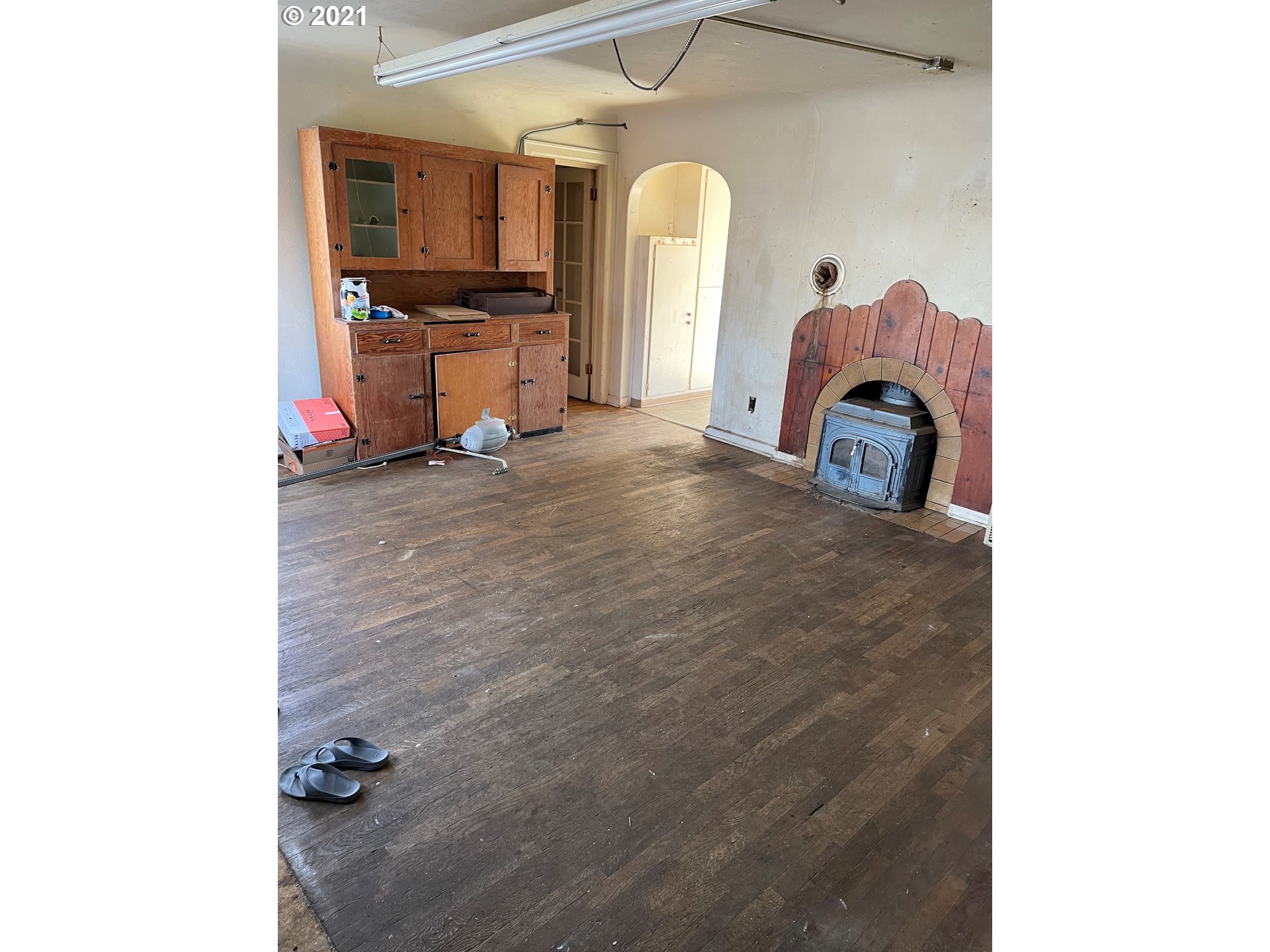 439 Q Street Springfield, OR 97477 - Photo 6 of 18 a view of a kitchen with a sink and a fireplace
