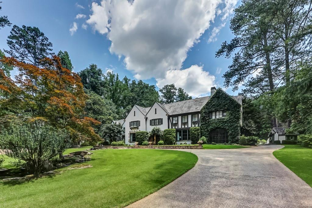225 Valley Road Northwest Atlanta, GA 30305 - Photo 1 of 1 a front view of a house with a yard