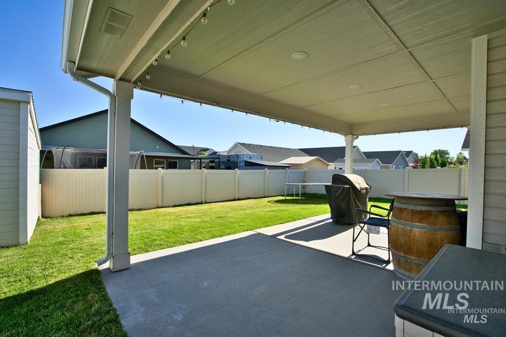12656 Brun Street Caldwell, ID 83607 - Photo 28 of 39 Fenced backyard with a patio and a grill