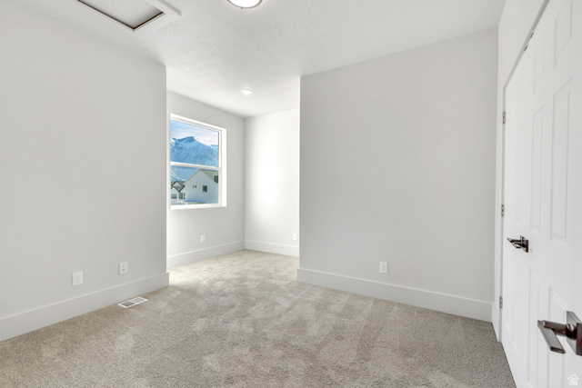 547 North Hvn Drive Mapleton, UT 84664 - Photo 18 of 23 Empty room with baseboards and light carpet