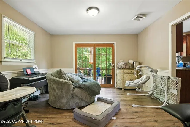 a bed room with furniture and a window