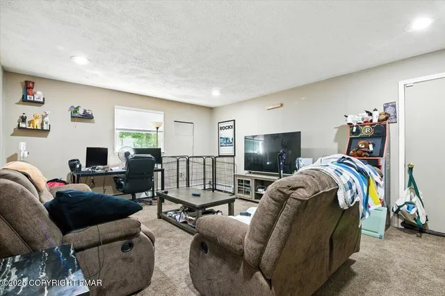 a bathroom with a toilet sink vanity and mirror