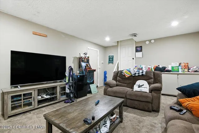 a view of a hallway with wooden floor and entryway