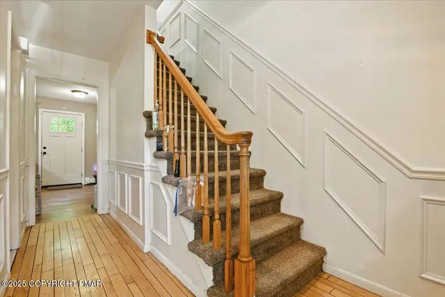 a bedroom with a bed and mirror