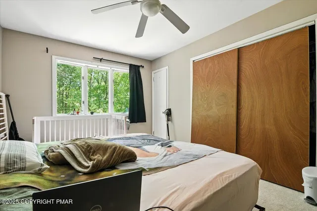 a bathroom with a sink vanity mirror and toilet