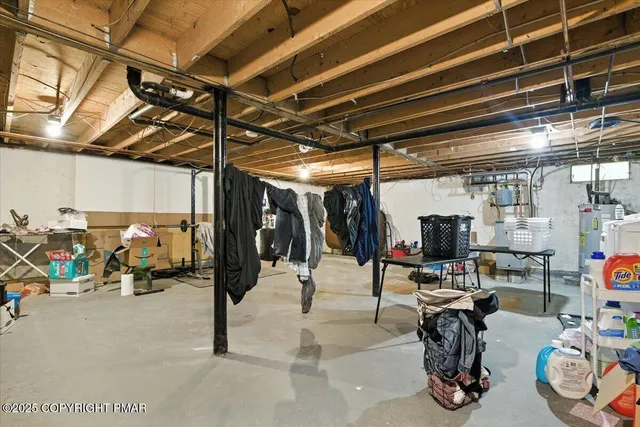 a view of a patio with a table chairs and a fire pit