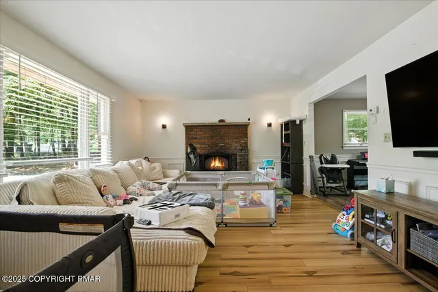 a living room with furniture and a flat screen tv