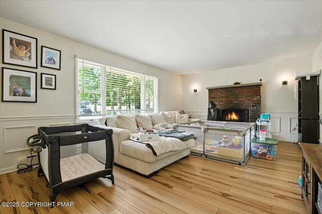 a kitchen with stainless steel appliances granite countertop wooden cabinets a refrigerator a stove a sink and a microwave