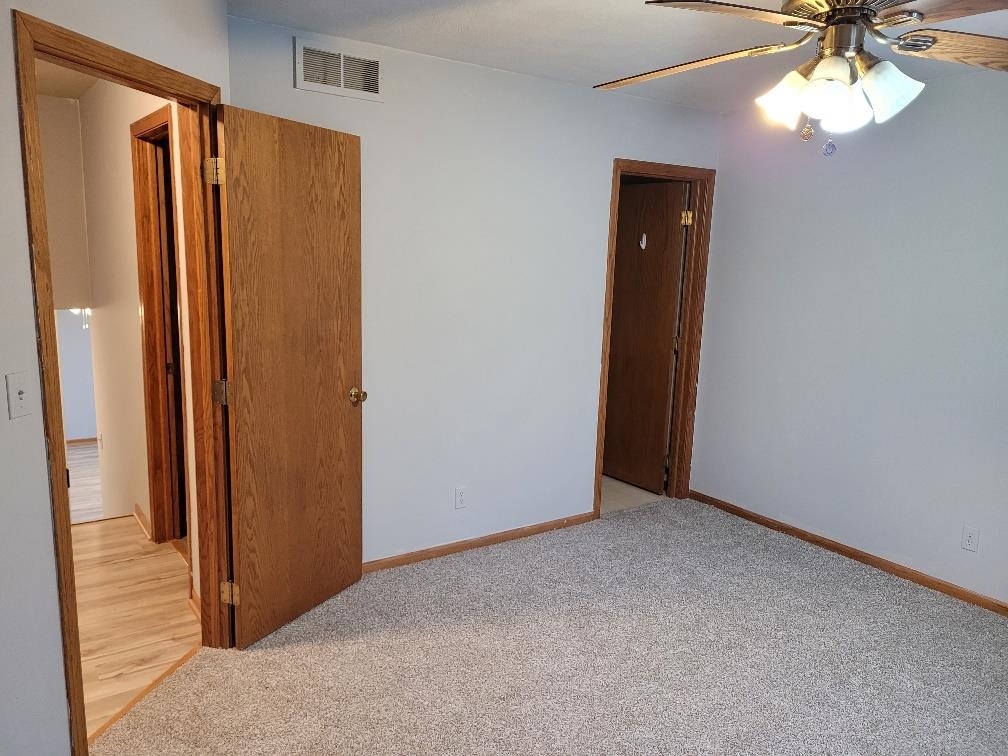 960 South Trainer Road Rockford, IL 61108 - Photo 13 of 31 an empty room with windows and closet