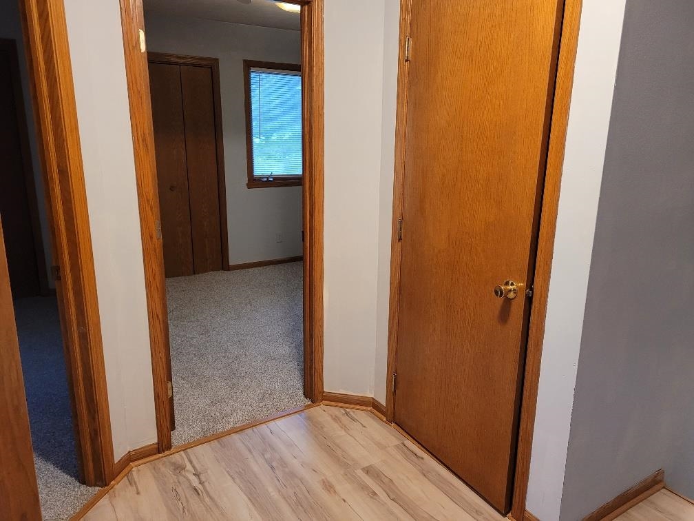 960 South Trainer Road Rockford, IL 61108 - Photo 18 of 31 a view of a hallway with wooden floor