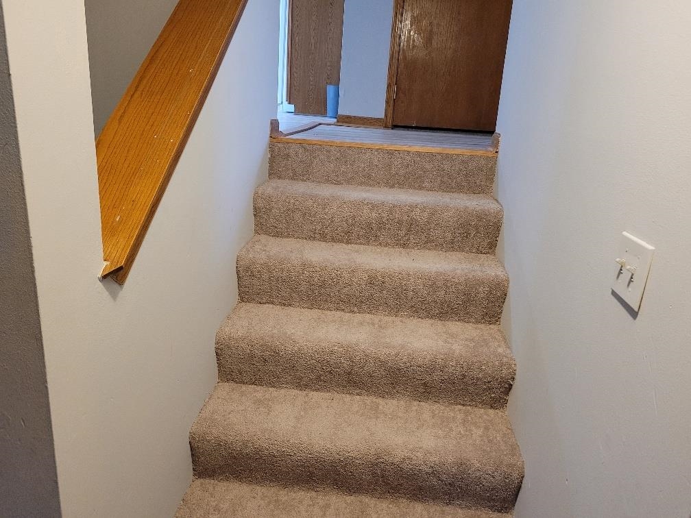 960 South Trainer Road Rockford, IL 61108 - Photo 22 of 31 a view of staircase with white walls and white door