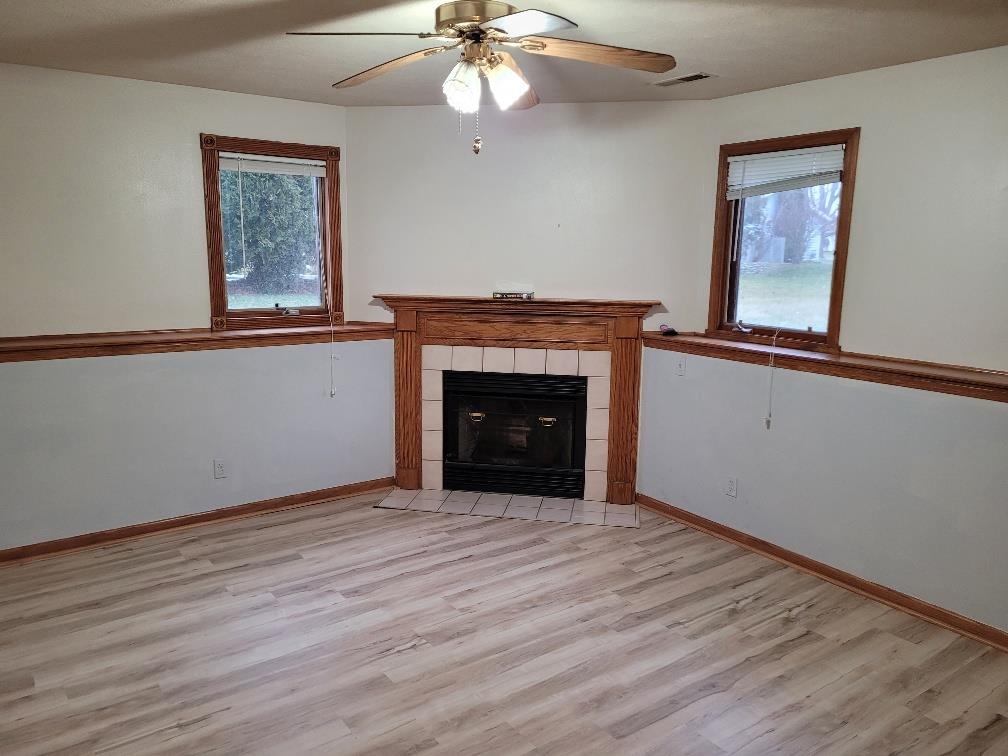 960 South Trainer Road Rockford, IL 61108 - Photo 24 of 31 a view of an empty room with wooden floor and a window