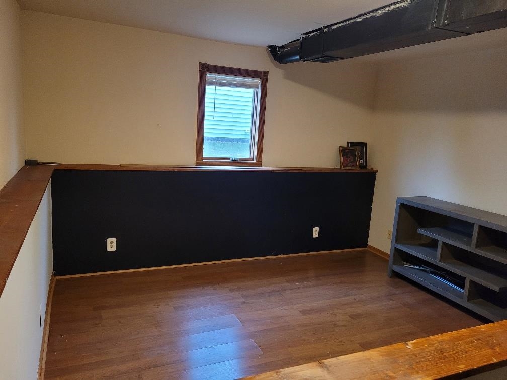 960 South Trainer Road Rockford, IL 61108 - Photo 25 of 31 a view of an empty room with wooden floor and a window